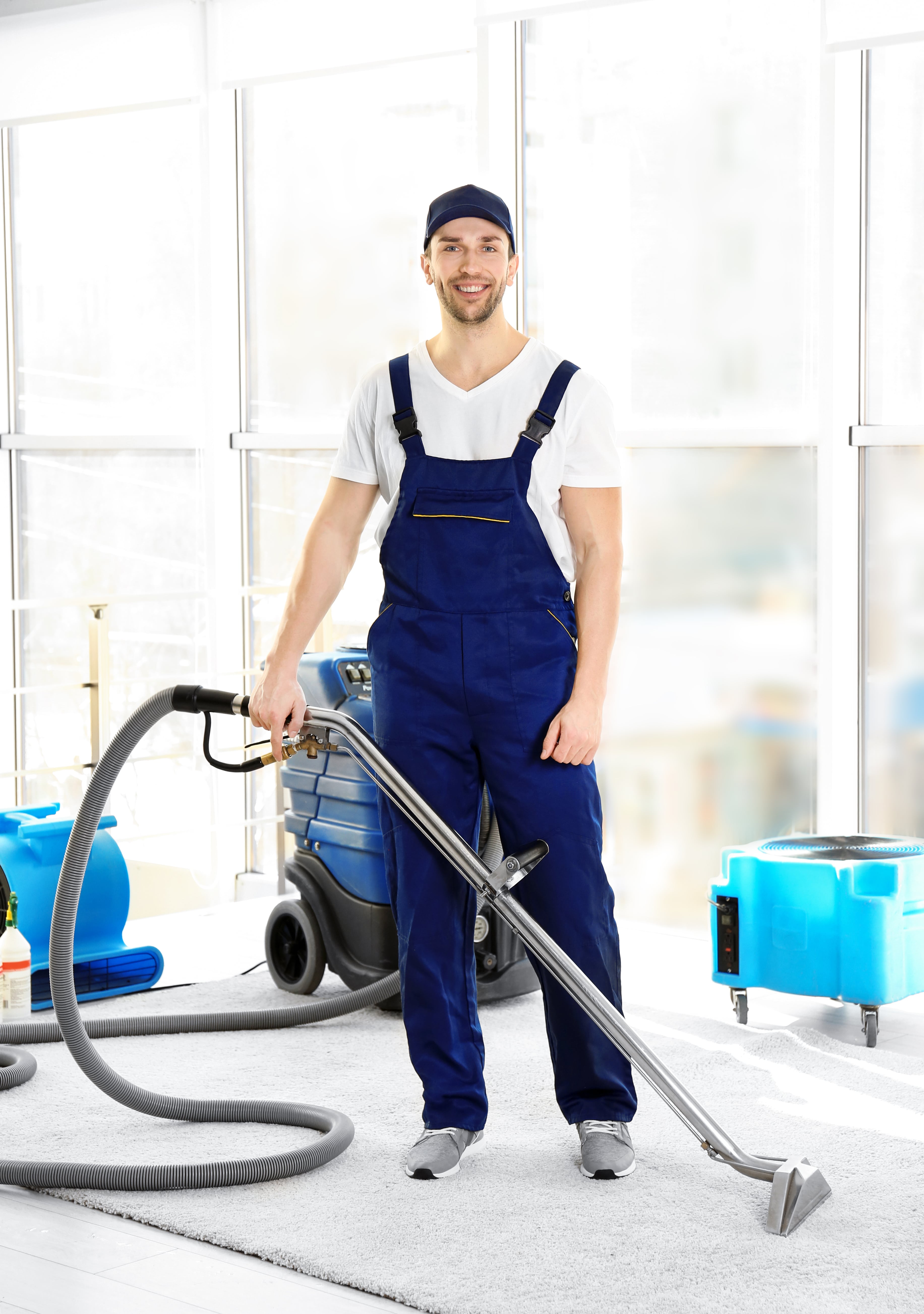 Carpet Cleaner employee removing dirt from carpet in flat