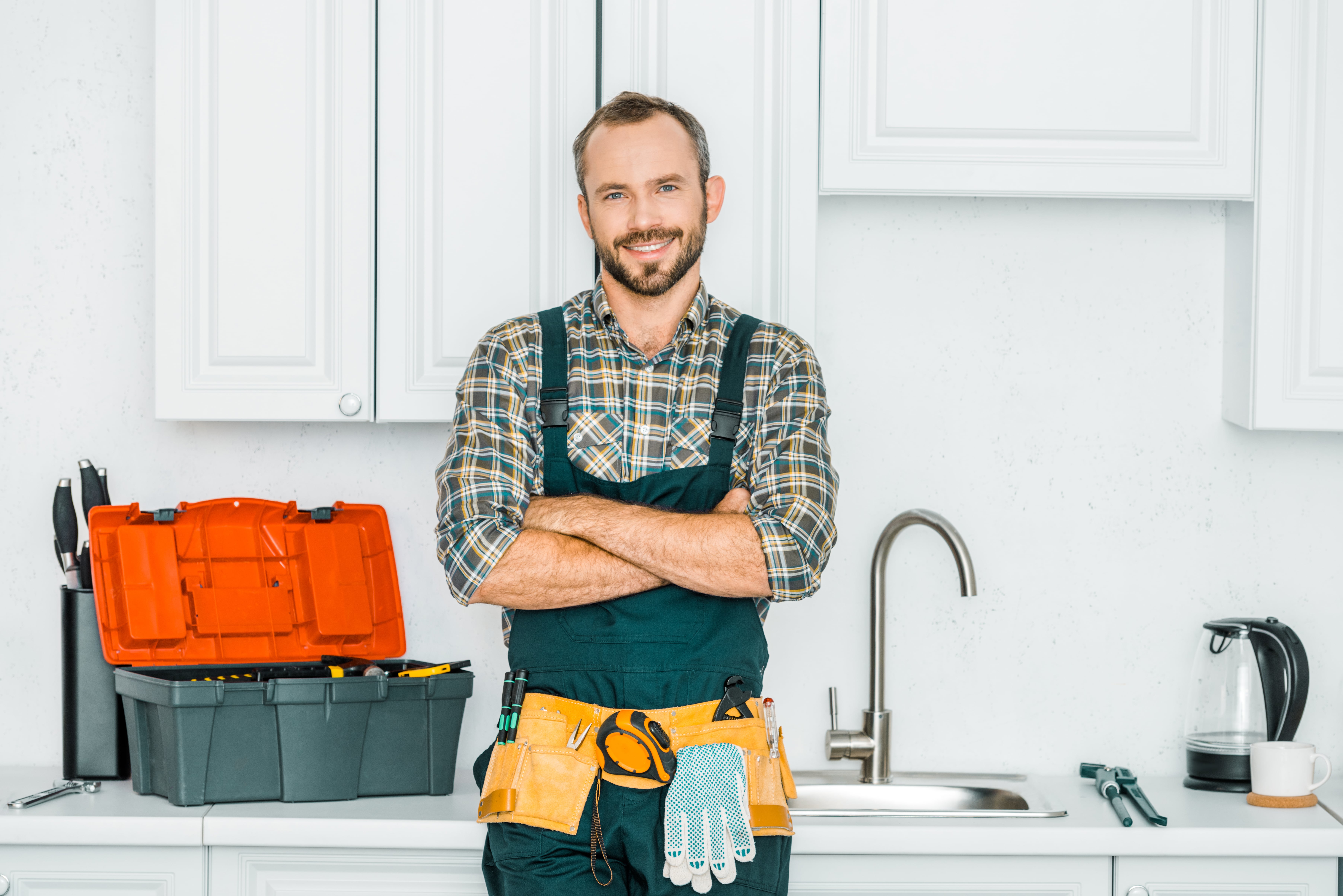 Portrait of handyman in front of kitchen