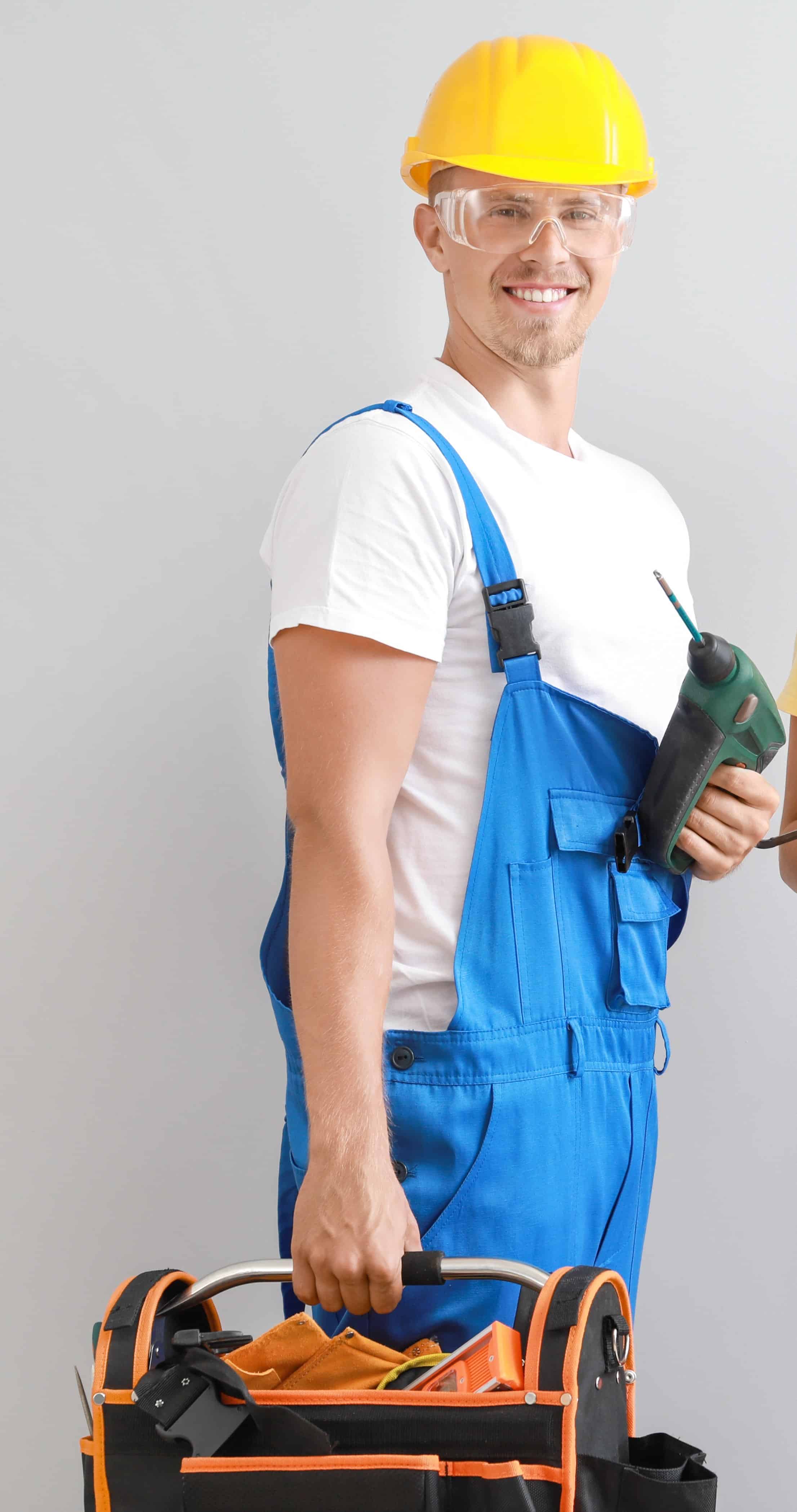 Home Renovation Man with tools wearing a helmet and an overall