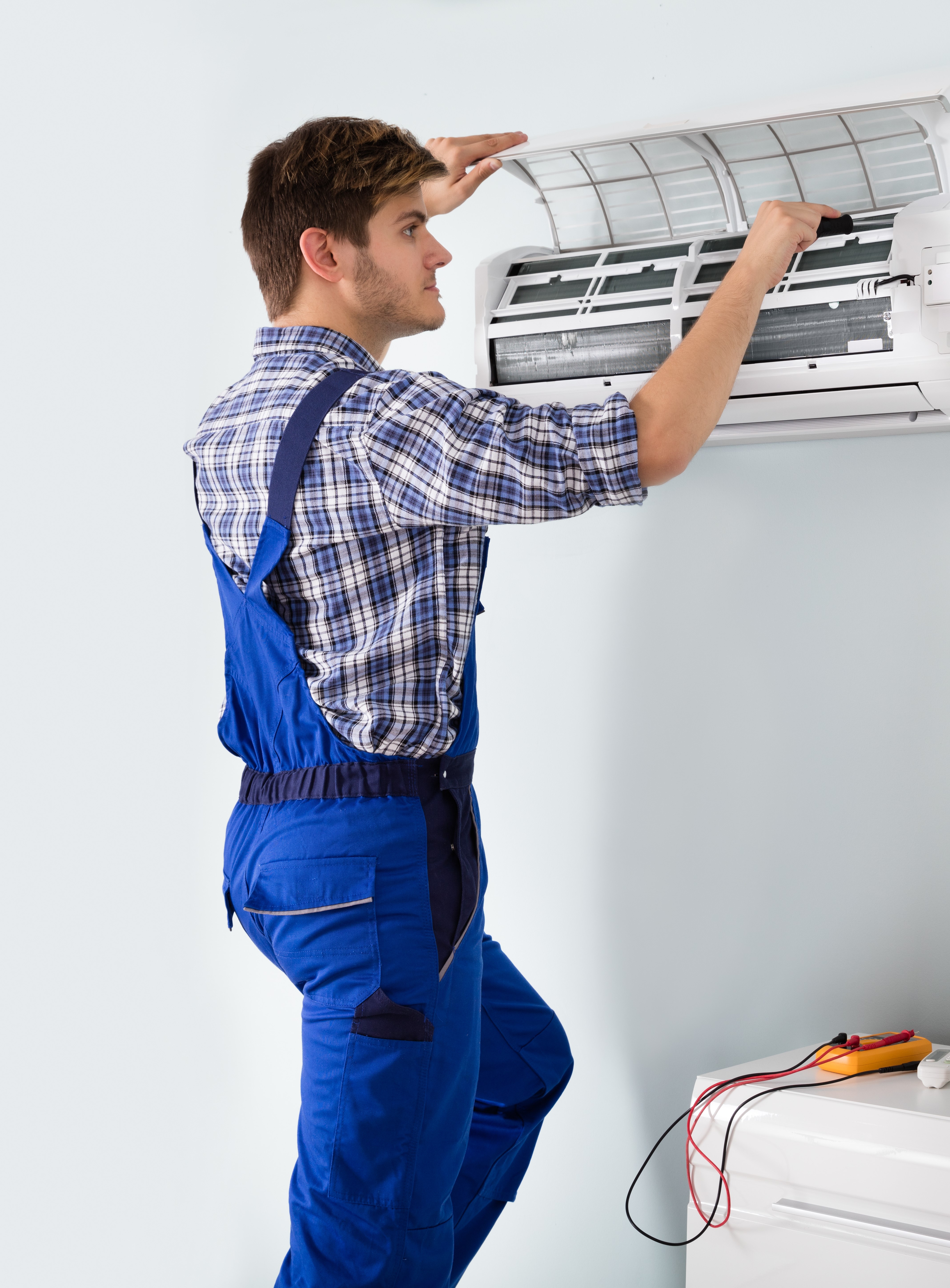 Young Male Technician Air Conditioning Installer At Home