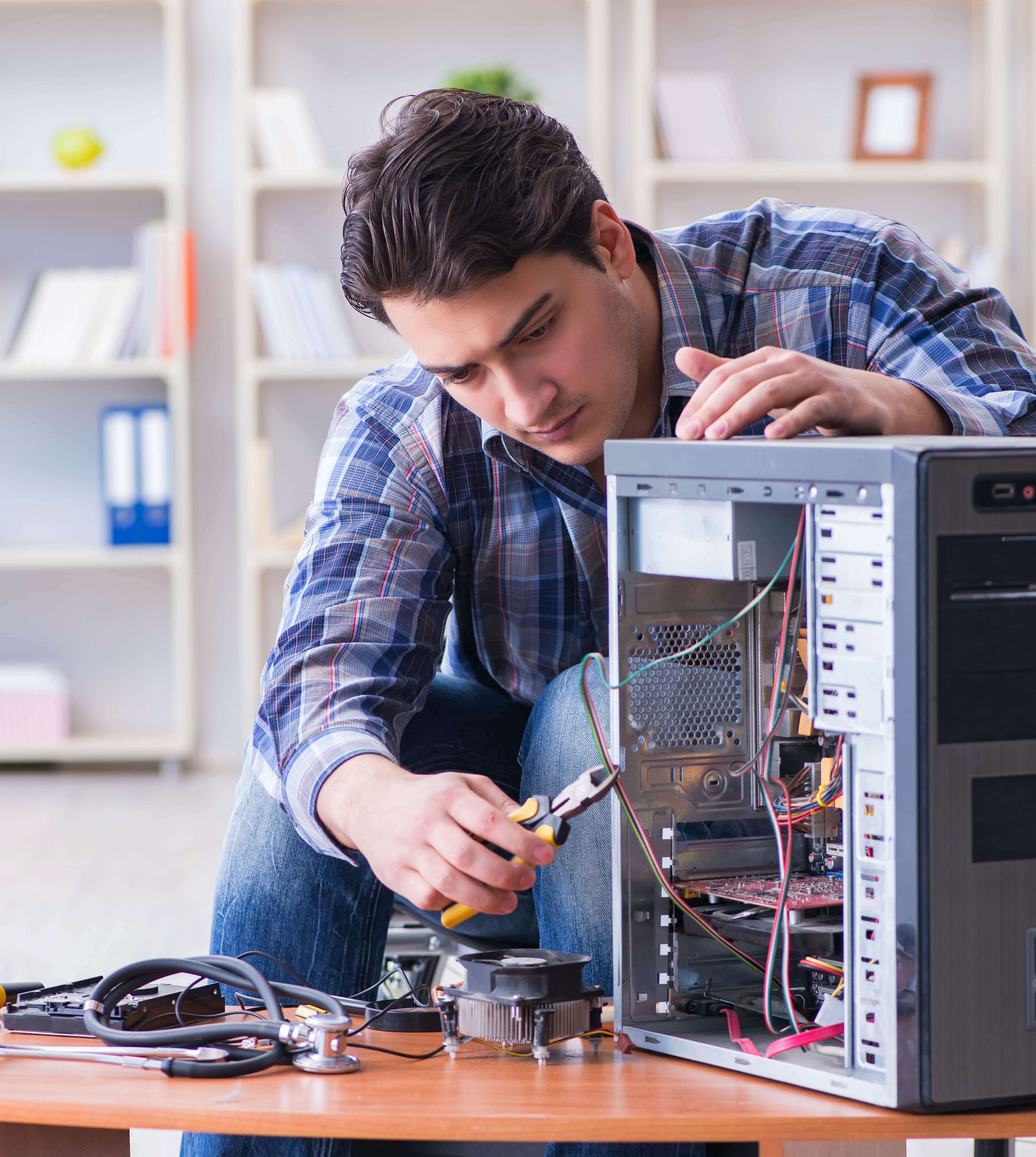 Portrait of a man repairing a computer