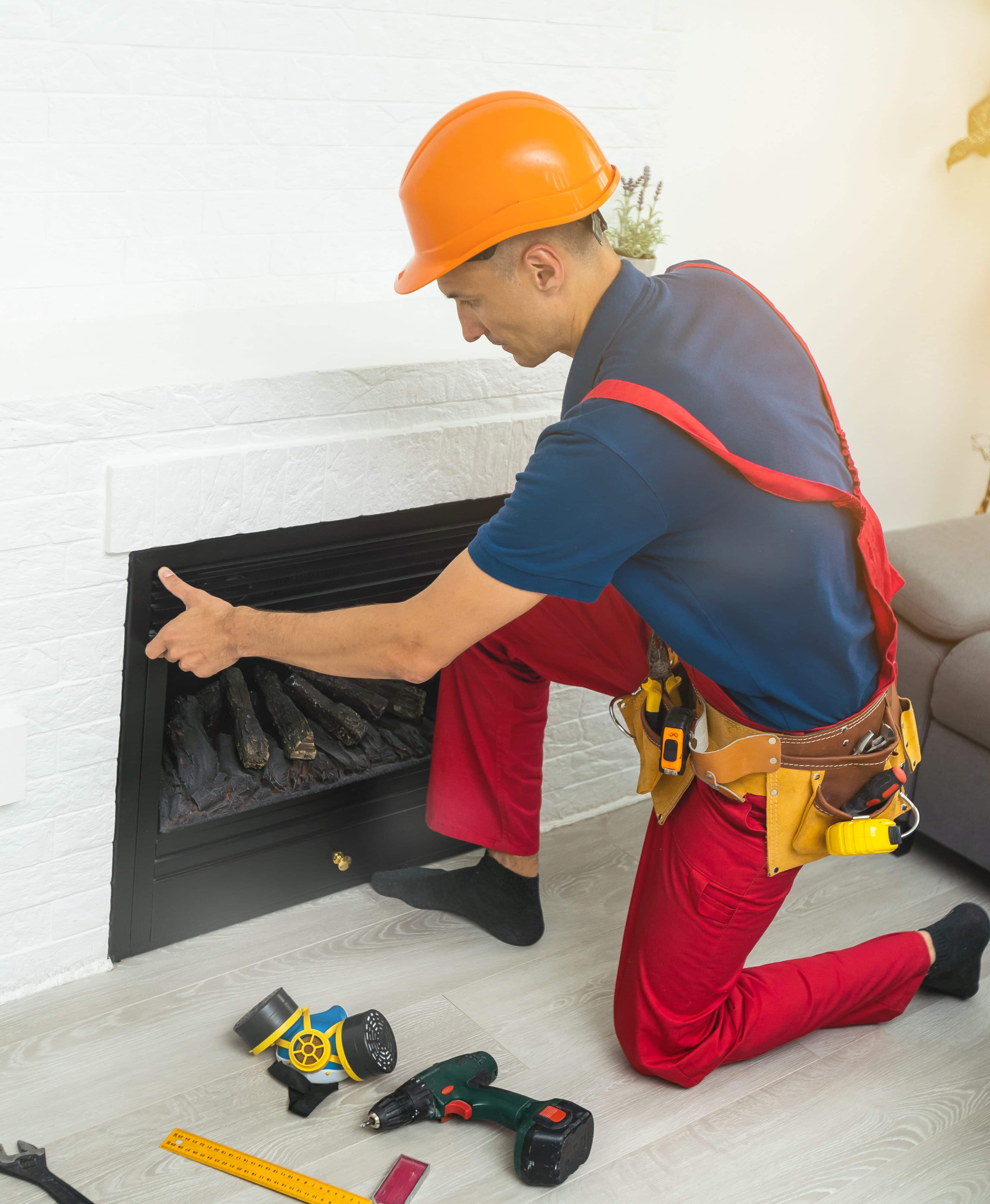 Fireplace installing in white brick wall