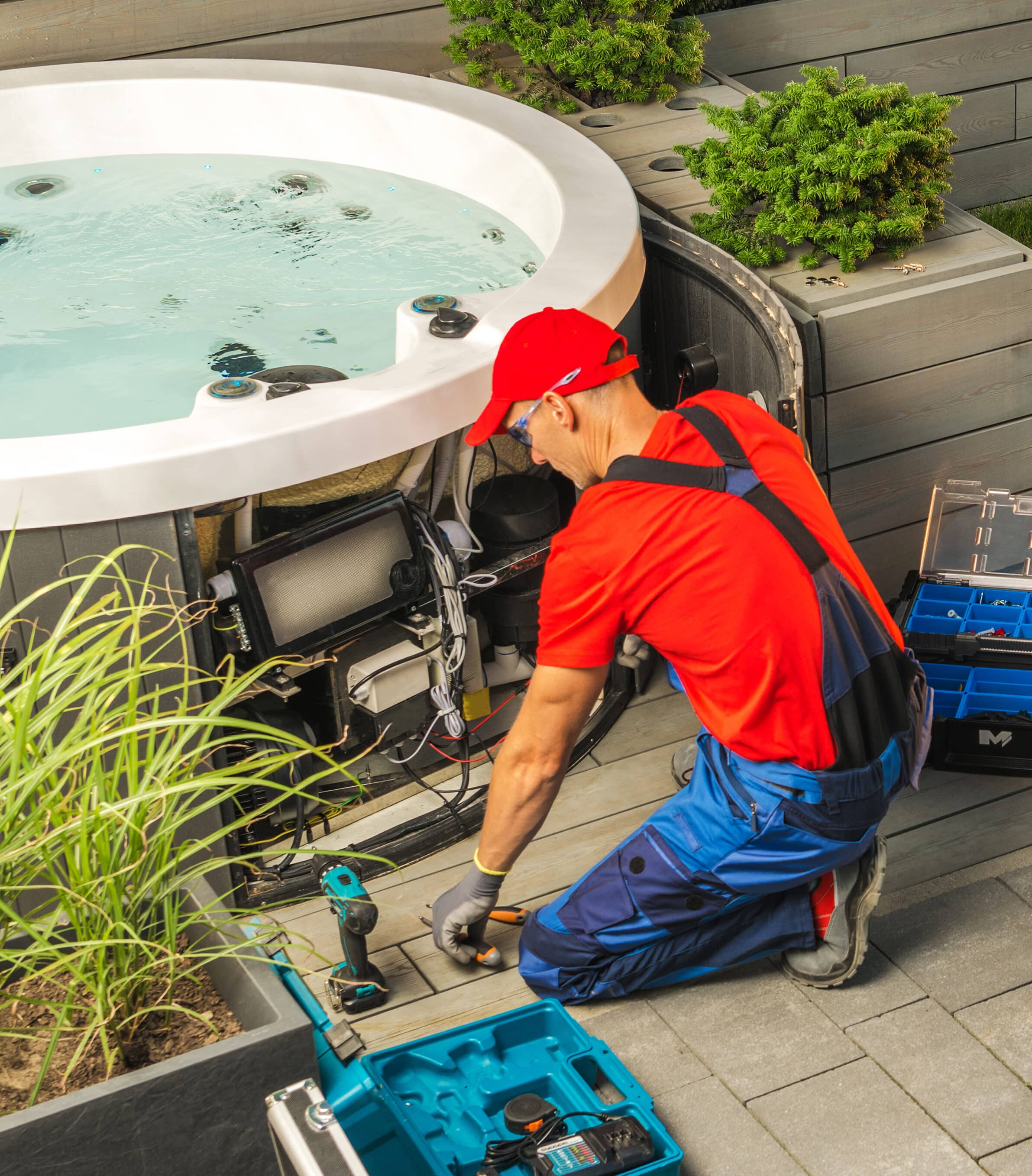 Small Residential Hot Tub Maintenance Performed by Caucasian SPA Technician.