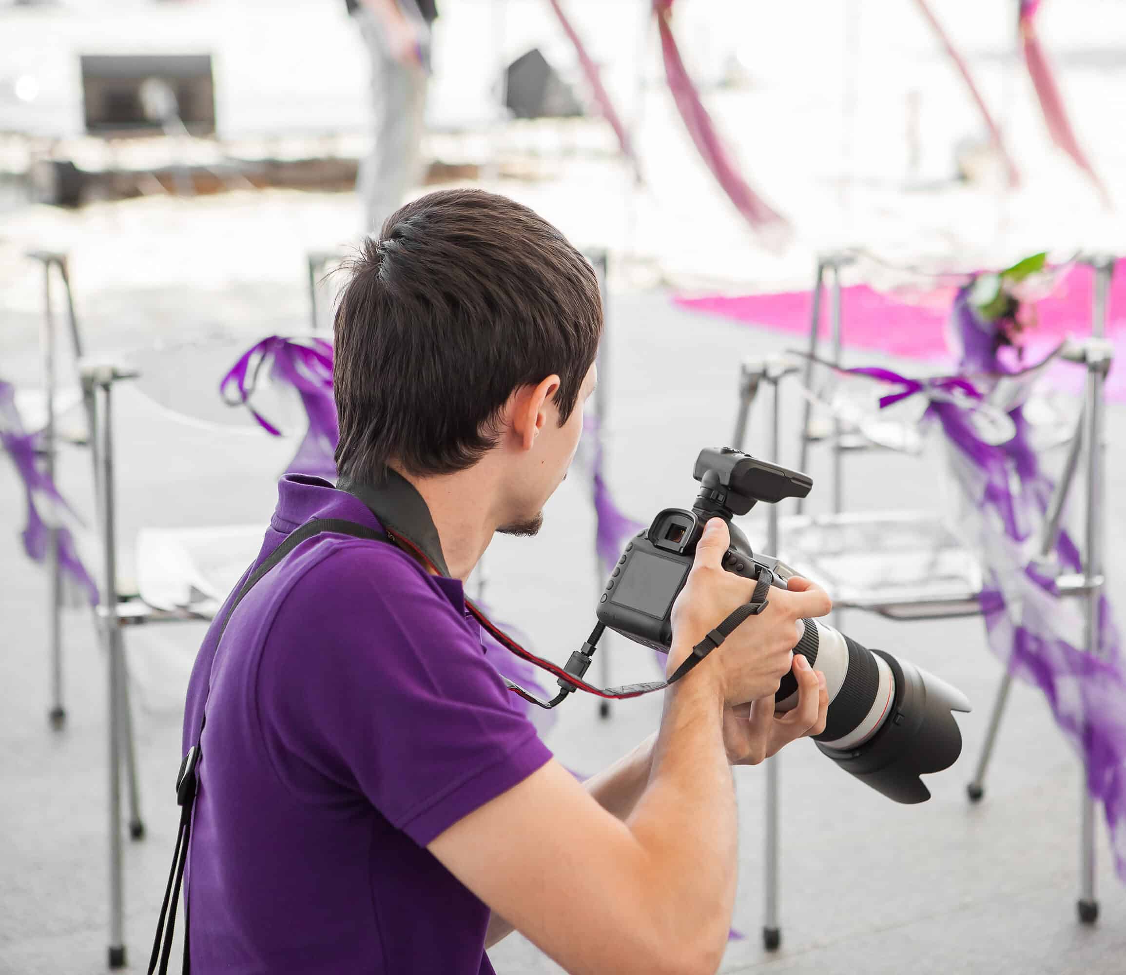 Wedding photographer taking photographs of wedding