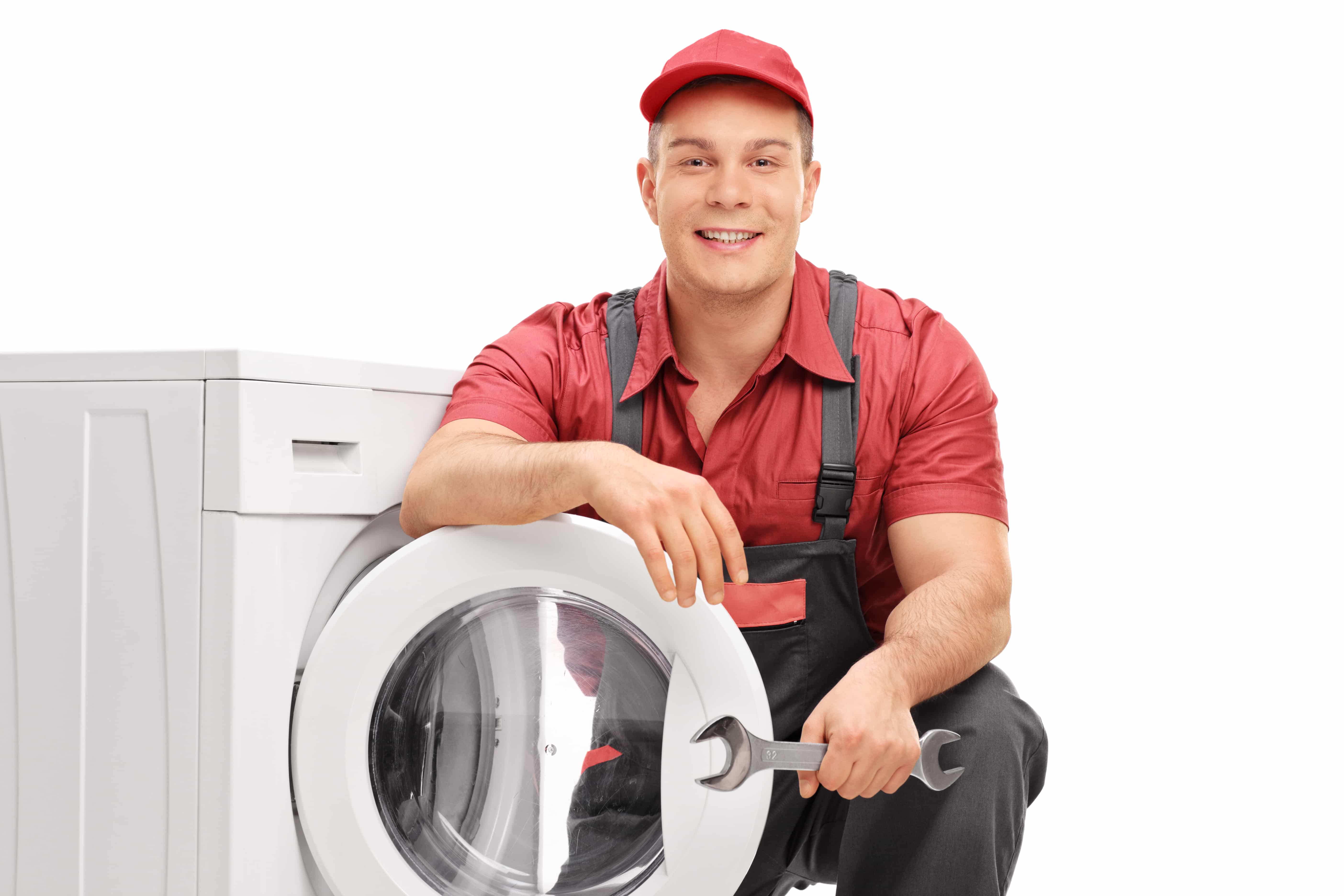 Washing machine repairman holding a wrench beside a washing machine