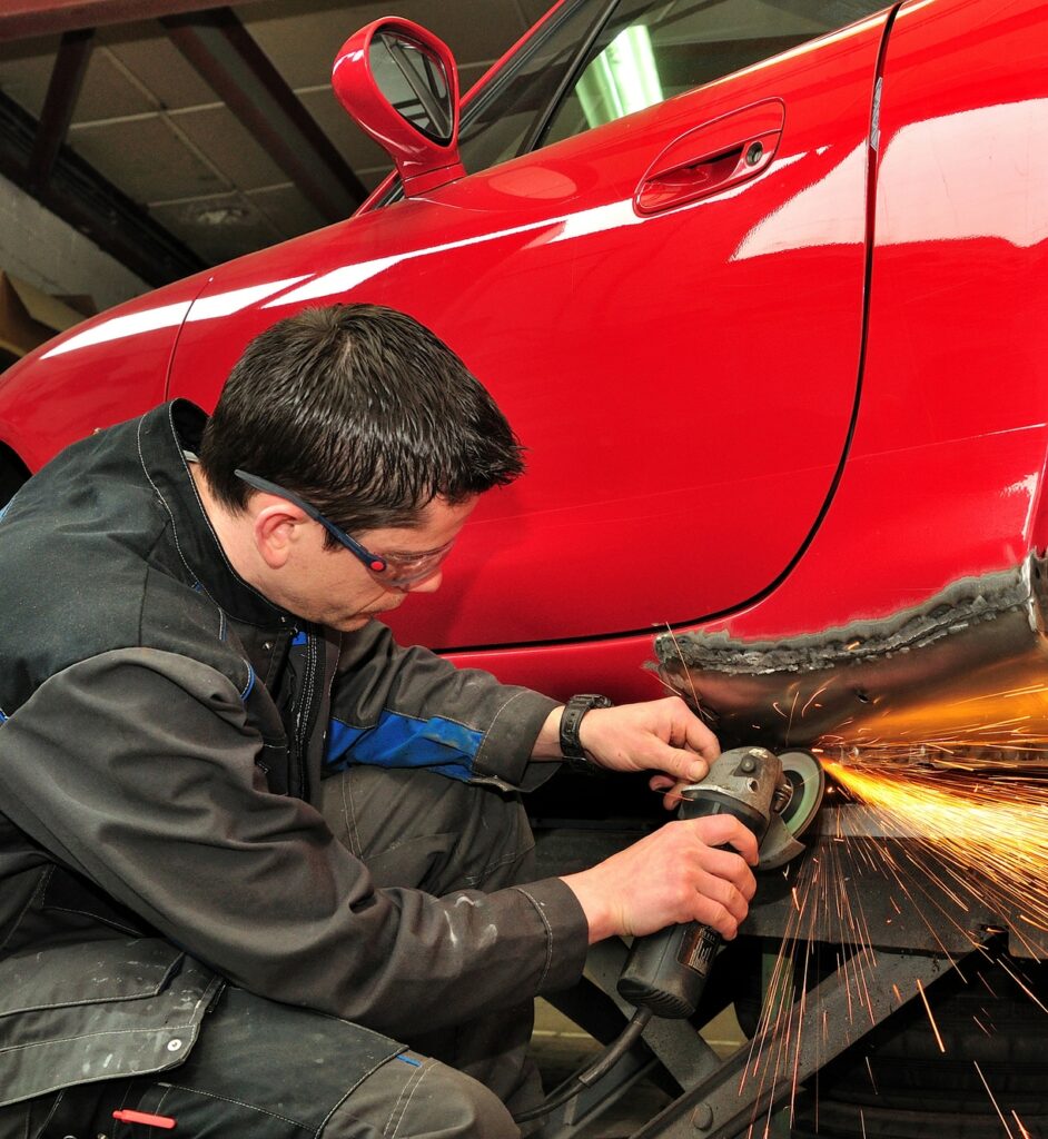 Portrait of a Man doing some Car Bodywork Repair