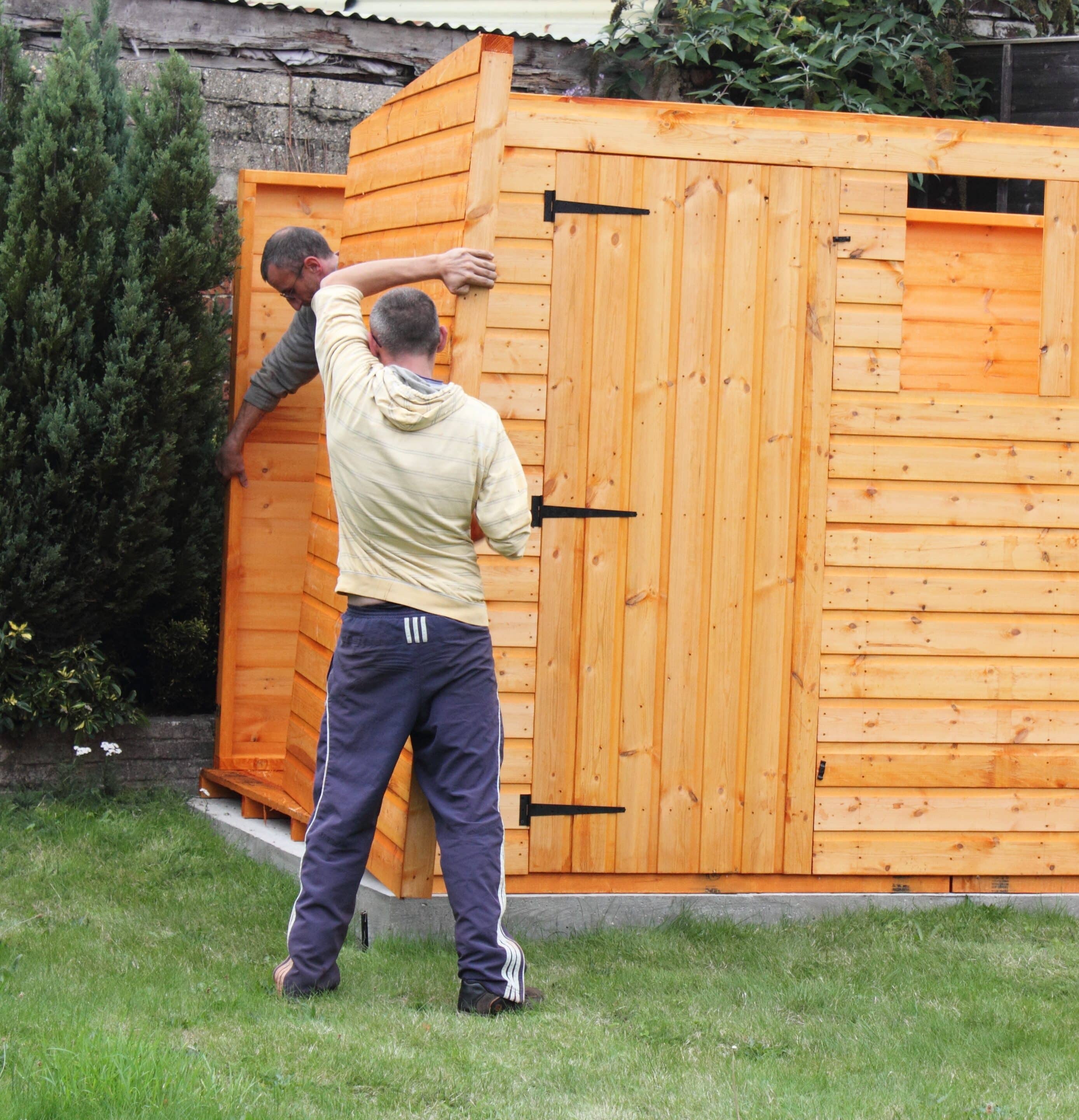 Portrait of two Man Building a Garden shed
