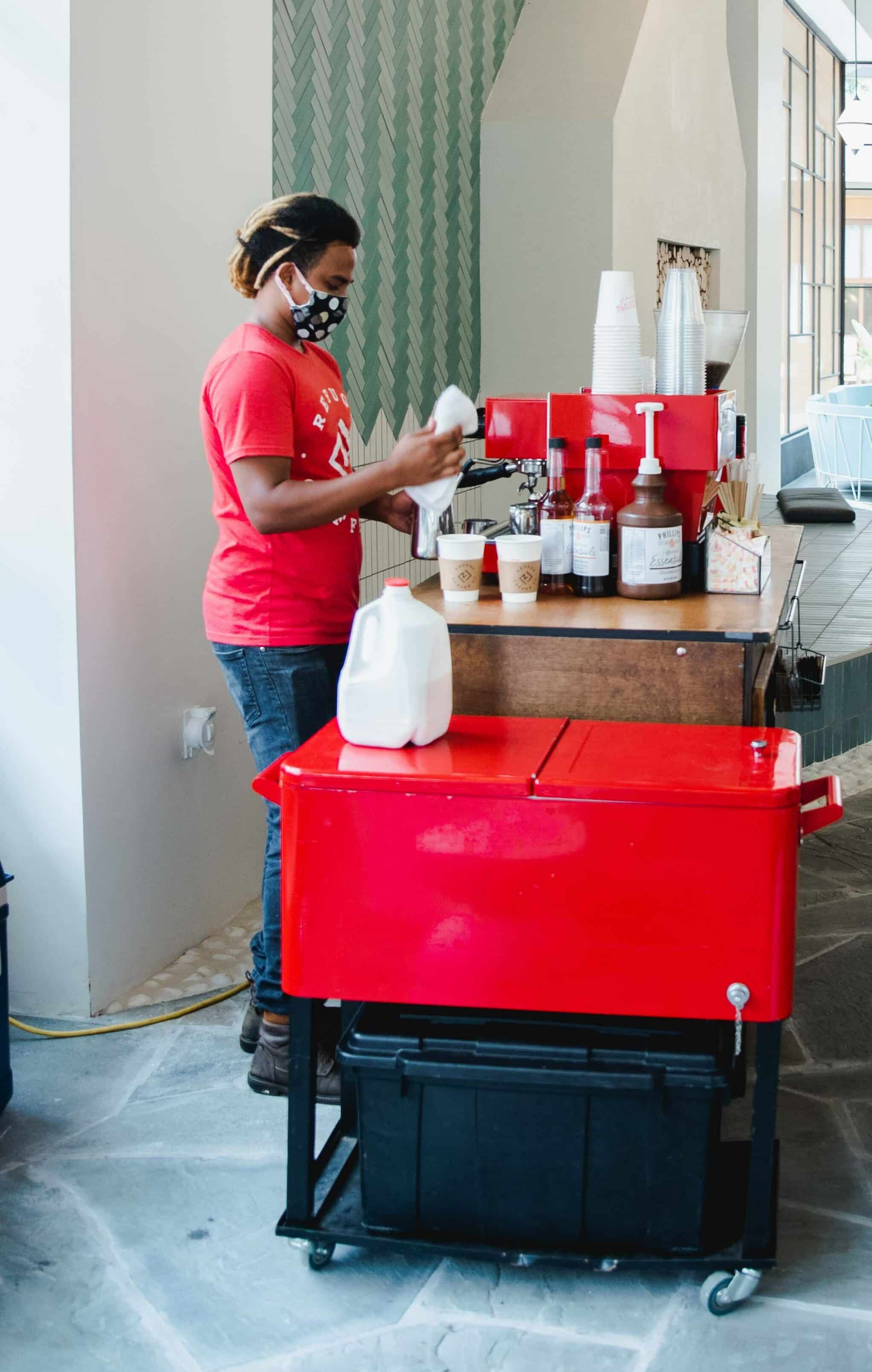 Portrait of a ayoung Man working on a Coffee Cart Hire