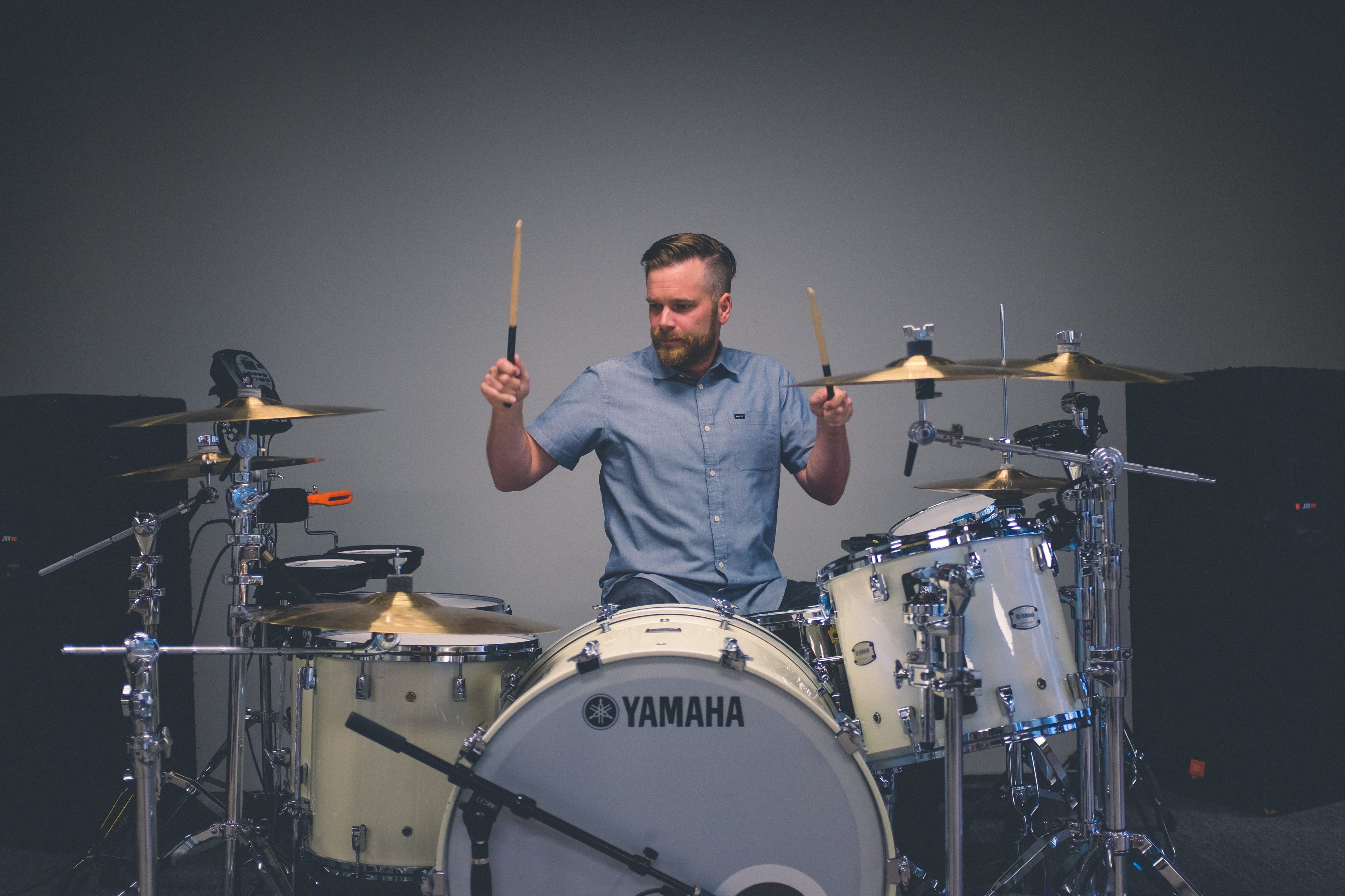 Portrait of a man giving a Private Drum Lesson